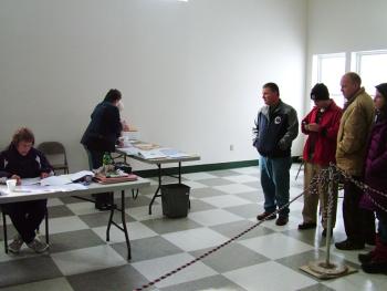 Selectwoman Kathy Littlefield of the town of Waldo reads tallies to Senate District 11 candidates Michael Thibodeau (R-Winterport), far left in group, and Jonathan Fulford (D-Monroe), second from right on the morning after Election Day. On Nov. 6, Fulford requested a recount. (Photo by Ethan Andrews)