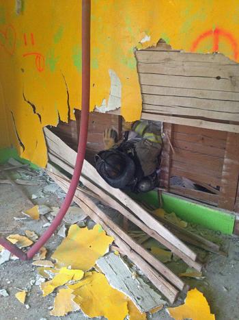 Firefighters also practiced getting through tight holes in walls and searching for ‘victim’ firefighters by crawling through tunnels in the dark. (Courtesy Jason Peasley)