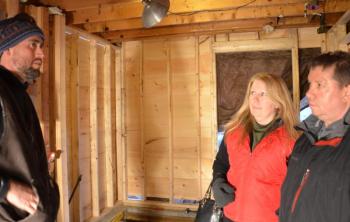 Brian Fitzpatrick with Karen Keber and Matt Sutton, going over construction details. (Photo by Lynda Clancy)