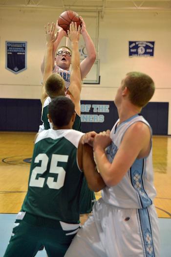 Oceanside’s Nick Mazurek, back, powered up for one of his three 3-pointers as he led the team with 24 points. (Photo by Ron Hawkes)