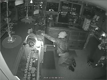 A surveillance video image of a burglar inside Bennett’s Gems & Jewelry, early Monday morning. (Photo courtesy of Belfast Police Department)