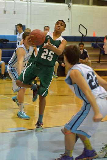 Mount View’s Devon Davis, left, goes up with a shot over Oceanside’s Anthony Marsh. (Photo by Ron Hawkes)