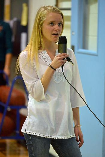Oceanside’s Riley Simmons did an outstanding job singing the National Anthem to start the game. (Photo by Ron Hawkes)
