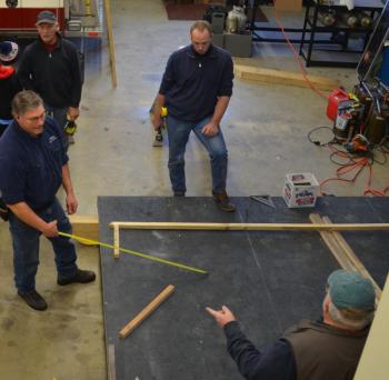Phil Brown, Michael Callaway, John Wickenden and Allen Mitchell get the framing underway. (Photo by Lynda Clancy)