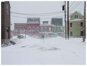 Cross Street, facing Rollie’s Bar and Grill. The business was open on Tuesday while most others downtown remained closed for the storm. (Photo by Ethan Andrews)