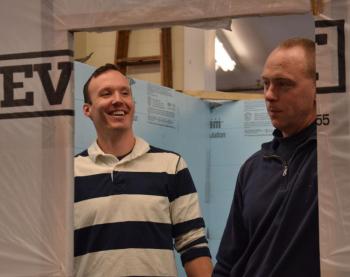 Ian Robertson and John Wickenden, after getting the insulation installed. (Photo by Lynda Clancy)