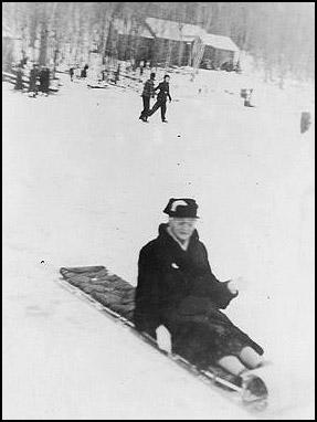 The oldest member of the Camden Outing Club on Feb. 22, 1937 was 88 years old, but that did not stop her from riding a toboggan down the chute. (Photo courtesy David Dickey)