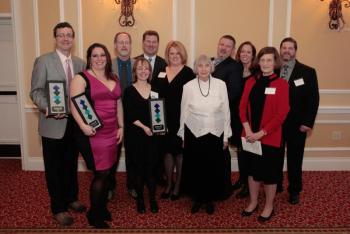 Chamber Awards Winners (L-R): Rick Bresnahan from Pitch; Devon Salisbury from "Pop For Change;" Ken Gross and Jennifer Temple from Camden Winterfest; President of the PBRCC Board, Mike Hall; PBRCC Executive Director Staci Coomer; Leona Pierpont, Community Volunteer of the Year; Frank Isganitis, Chamber Community Person of the Year; Heidi Neal from Loyal Biscuit; Judy O'Dell from Maine Media Workshops + College; and Joel Neal Jr. from Loyal Biscuit. issing: athenahealth, Economic Enhancement winner and Hope Elephants, Special Recognition award winner.