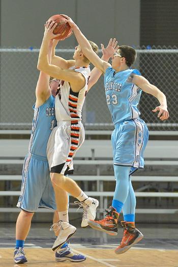 Oceanside’s Jarrod Leonardi, right, gets a block from behind on Winslow’s Justin Martin on Saturday. (Photo by Ron Hawkes)