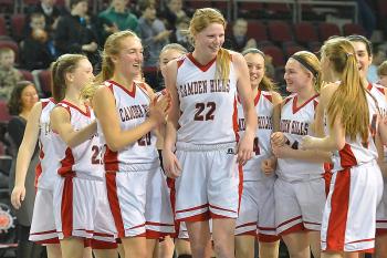 The Camden Hills girls are all smiles after defeating Oceanside in an Eastern Class B regional quarterfinal game Saturday 49-45. (Photo by Ron Hawkes)