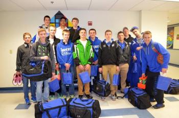 The Searsport boys basketball team poses for a team photo before its Friday departure from the school. (Courtesy Connie Burkard)
