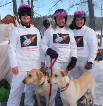 The Millinocket Rockettes includes Cathy Rowe, Joannie Goldblatt and Jane Montanaro. The dogs are Charlie and Roadie. #toboggannationals