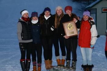 Several Camden Hills girls alpine skiers hold up the Class B girls runner up plaque. Pictured, from left, are Audrey Heriz-Smith, Samantha Zwecker, Molly Mann, Brynne Wrona, Renaissance Lyman and Katherine Dailey. Not pictured are Lydia Morin, Ella Simon, Raine Ellison and Abby Chamberlin. (Courtesy David Lyman)