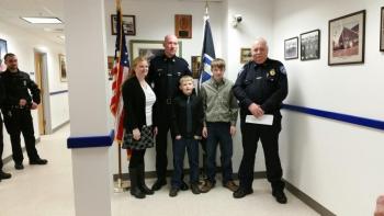 Rockland Police Deputy Chief Chris Young was appointed to his new position at a badge pinning ceremony Feb. 2 at the station. Pictured with Young, from left, are his wife, Bobbi, stepsons Jaiden and Brandon, and Chief Bruce Boucher. (Photo by Sarah Shepherd)