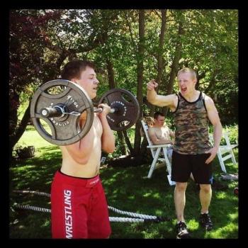 Camden Hills’ wrestler Eli Smith, left, training hard with CJ Fitness’ Jack Hauprich. (Courtesy Eli Smith)