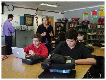 English Language Arts teacher Sue Warren, standing, gives test-taking tips to students during a practice session for the SBAC test. (Photo by Ethan Andrews)