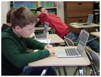 Students Jack, left, and Cyrus work on a practice version of the Smarter Balanced math test. (Photo by Ethan Andrews)