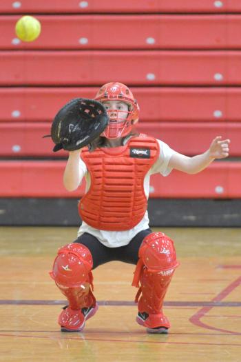 Camden Hills’ Nicole Brown catches during Thursday’s pitching drills. (Photo by Ron Hawkes)