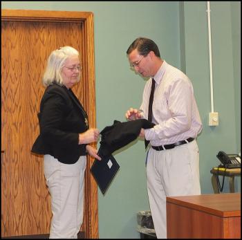 Knox Sheriff Donna Dennison receives her award from Andrew Hart for 23 years of service.