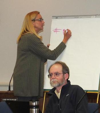 Councilor Louise MacLellan-Ruf made notes of public speakers comments. Also pictured is Councilor Larry Pritchett.