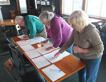 Volunteers look over committee positions and chose events to help on.