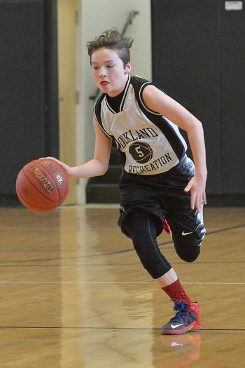 Rockland’s Finnegan Lynch is off to the races with a fast break. (Photo by Ron Hawkes)