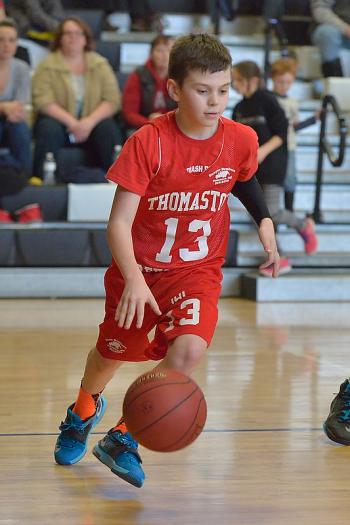 Thomaston’s Brayden Hyatt dribbles the ball towards the basket. (Photo by Ron Hawkes)