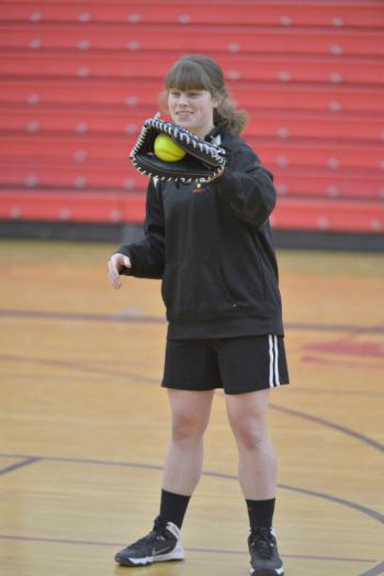 Camden Hills’ Maddie Bowman while an outstanding catcher, is also valuable in the infield and outfield to the Windjammers. (Photo by Ron Hawkes)