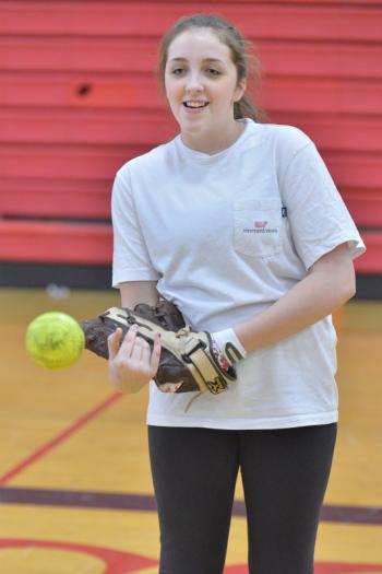 Camden Hills’ Gillian Lafleche warms up starting with the wrist flick. (Photo by Ron Hawkes)