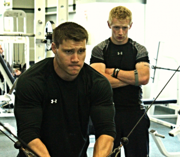 Jacob Powers, another former Windjammer, trains hard with Jack Hauprich, back, of CJ Fitness. (Courtesy of Chris Chacon)