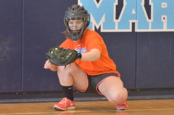 Oceanside’s Ari Curtis frames the ball during pitchers and catchers workout at Oceanside East Thursday. Curtis, one of the leagues stronger catchers should be a huge part of the Mariner lineup as long as she stays healthy. (Photo by Ron Hawkes)