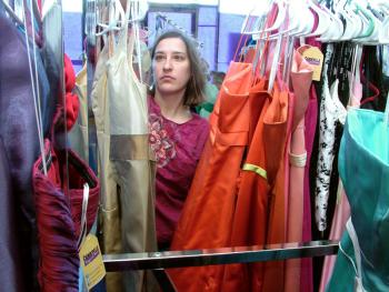 Heather Bryant, a volunteer with Cinderella Project of Maine, organizes formal dresses in preparation for the annual prom gown giveaway, to be held on April 4. (Photo by Ethan Andrews)