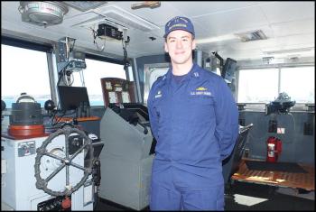 Lt. Zac Bender, commanding officer, on the bridge of the U.S. Coast Guard cutter ‘Thunder Bay.’ (Photo by Chris Wolf)