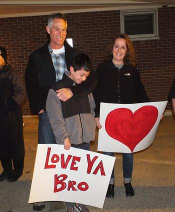 Mr. & Mrs. O'Farrell and Ryan O'Farrell made signs to wish a happy goodbye.