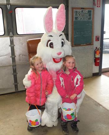 Two unidentified girls sat with the Eater Bunny.