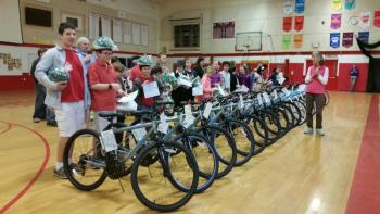 Student winners in the Bikes for Books program stand with their new mountain bikes. Photo by Sarah Shepherd