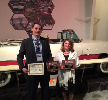 OHTM Auction and Event Coordinator Toby Stinson (left) and OHTM Volunteer Coordinator Niki Janczura show off three NAAM awards presented to the Museum at the National Association of Automobile Museums annual conference at the National Packard Museum in Warren, OH.