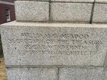 The cornerstone of the Camden post office, behind which a time capsule box is buried with a 1914 Camden Town Report, among other items. (Photo by Holly S. Edwards)