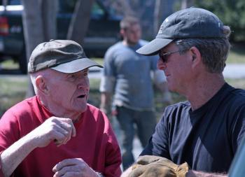 Art Henry and Ron Hawkins, during Monday’s work to move an historic barn that had belonged to the First Congregational Church of Camden to a neighbor’s property next door. (Photo by Holly S. Edwards)