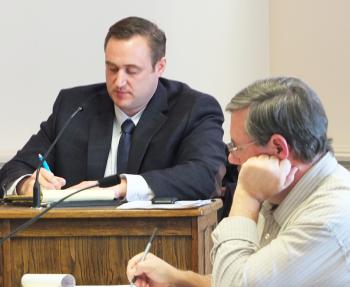 City Manager James Chaousis and clerk Stuart Sylvester during Friday’s session.