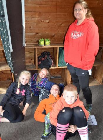 Shawn St. Cyr and his family are prepping to run the race, with a little relaxing in the lodge. (Photo by Lynda Clancy)