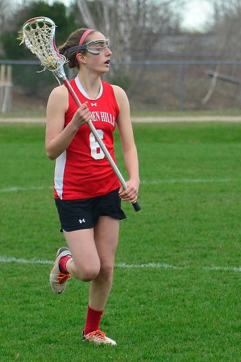 Camden Hills Isabelle Gutheinz races up the field looking to pass the ball. (Photo by Ron Hawkes)