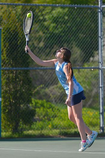 Oceanside’s Mary Allen serves during her first doubles match. (Photo by Ron Hawkes)