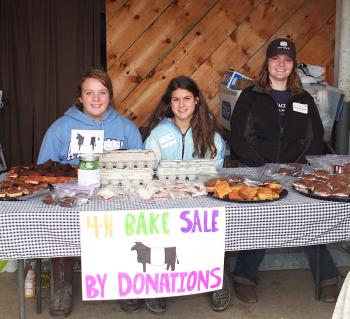 At the 4H booth is Sydney Gilbert (Hope), Audrey Bowman (Camden) and Ellie Pendleton (Rockport).