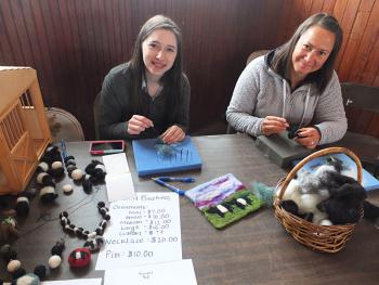 Quinn Bunting and Karen Leuthy make and display the Felting Project while selling Galloway Christmas ornaments.