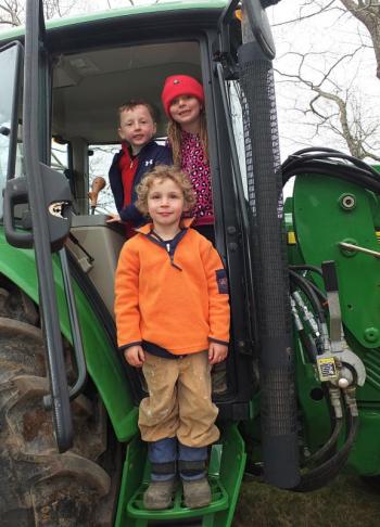 Three children, August Wells, Adela Brainard and Oscar Barnes exhaust themselves looking for the keys to the tractor. It was their fond desire to drive it around.