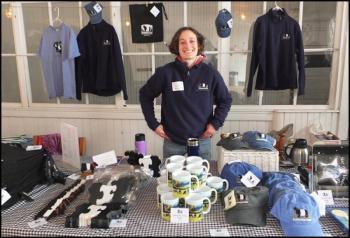 Joelle Aldbury, office and outreach manager at Aldermere Farm, mans the Aldermere table at Saturday’s program.