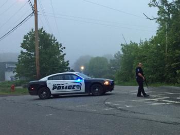 Camden Police officer Tim Davis blocks the intersection of Union and Limerock streets Tuesday night while other officers were hunting for a reported armed man they later identified as Dylan M. Urquhart. (Photo by Lynda Clancy)