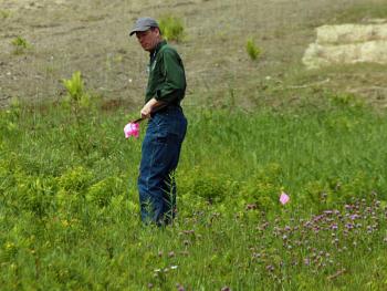 Snow Bowl Manager Landon Fake marks the areas on the mountain where he wants the students to spread the flower seeds. (Photo by Holly S. Edwards)