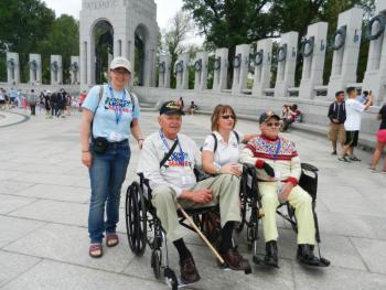 From left, Eva Murray, World War II veteran Ken Baker of Chelsea (USCG), a representative from Compass Rose Charities that helps sponsor Honor Flight, and World War II veteran Phil Collins of Gardiner. (USMC)